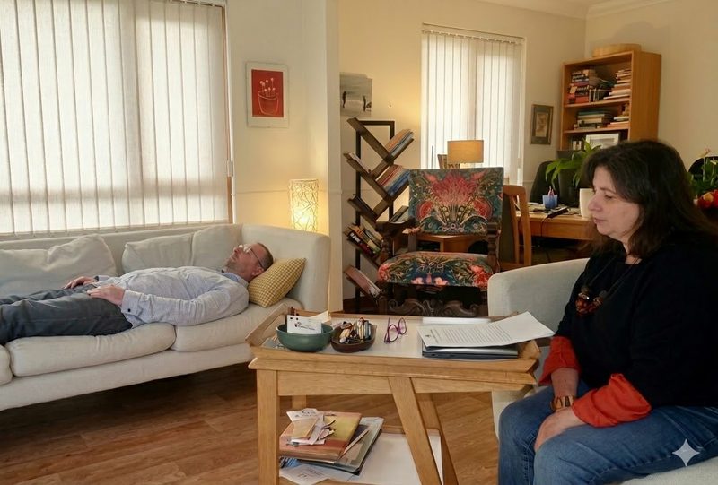 A hypnotherapy session in progress: Morven with a client in her calm, light-filled practice room